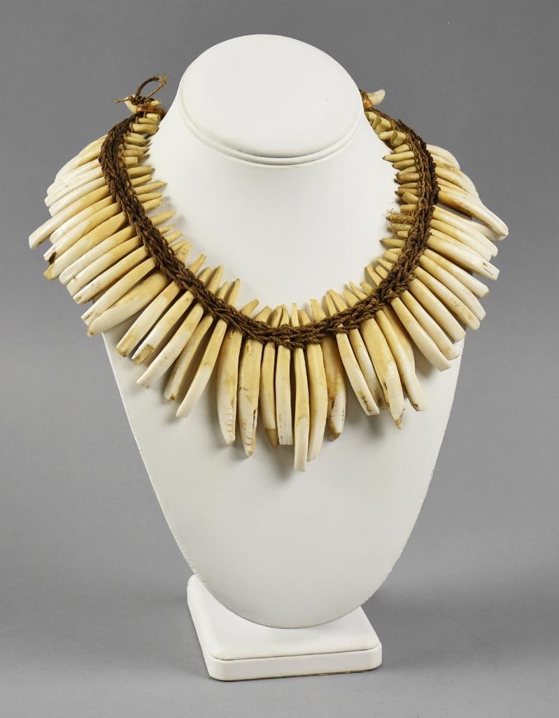 Papua New Guinea Pig or Boar Teeth Necklace: Very interesting necklace from Papua New Guinea. It is a necklace made from boar or pig teeth. Necklace is woven together with a natural fiber. Early pieces like this were used as currency. Teeth meas