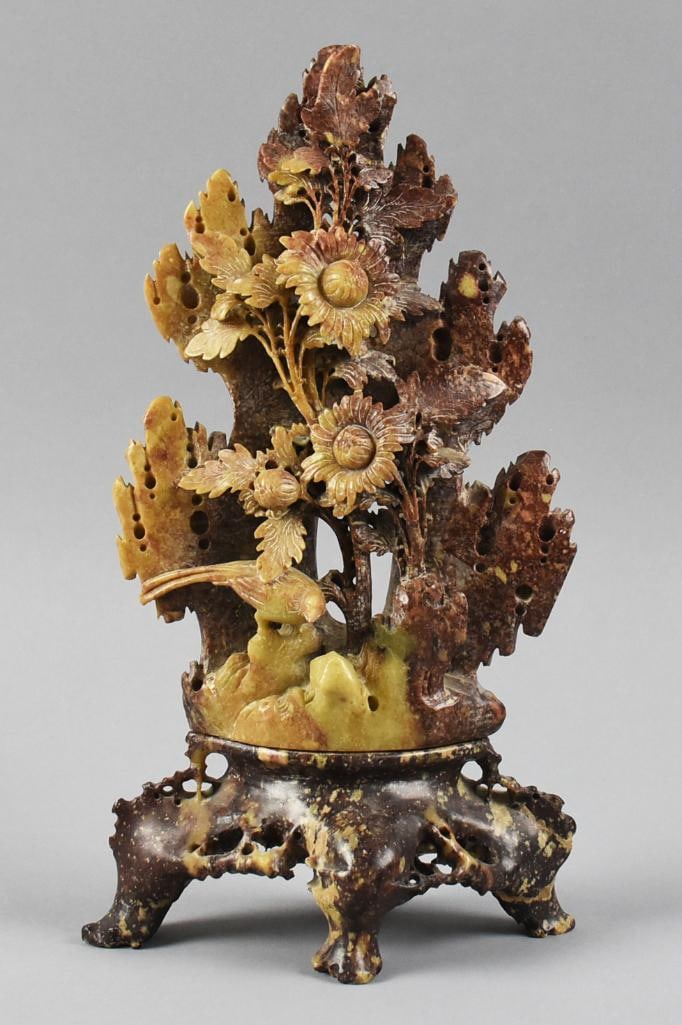Vintage Chinese Soapstone Flowers and Bird Sculpture: Wonderful vintage sculpture appears to be soapstone. Appears hand carved with daisy style flowers and a single bird. One sided decoration and comes on stand, possibly all one piece. Retains original p