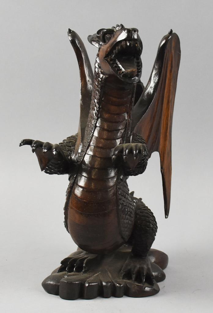 Vintage Chinese Winged Dragon Statue, Hand Carved: This awesome piece is believed to be of Chinese origin. Appears to be rosewood and hand carved. It is a roaring dragon with wings. No visible marks and stands approx. 12" tall.