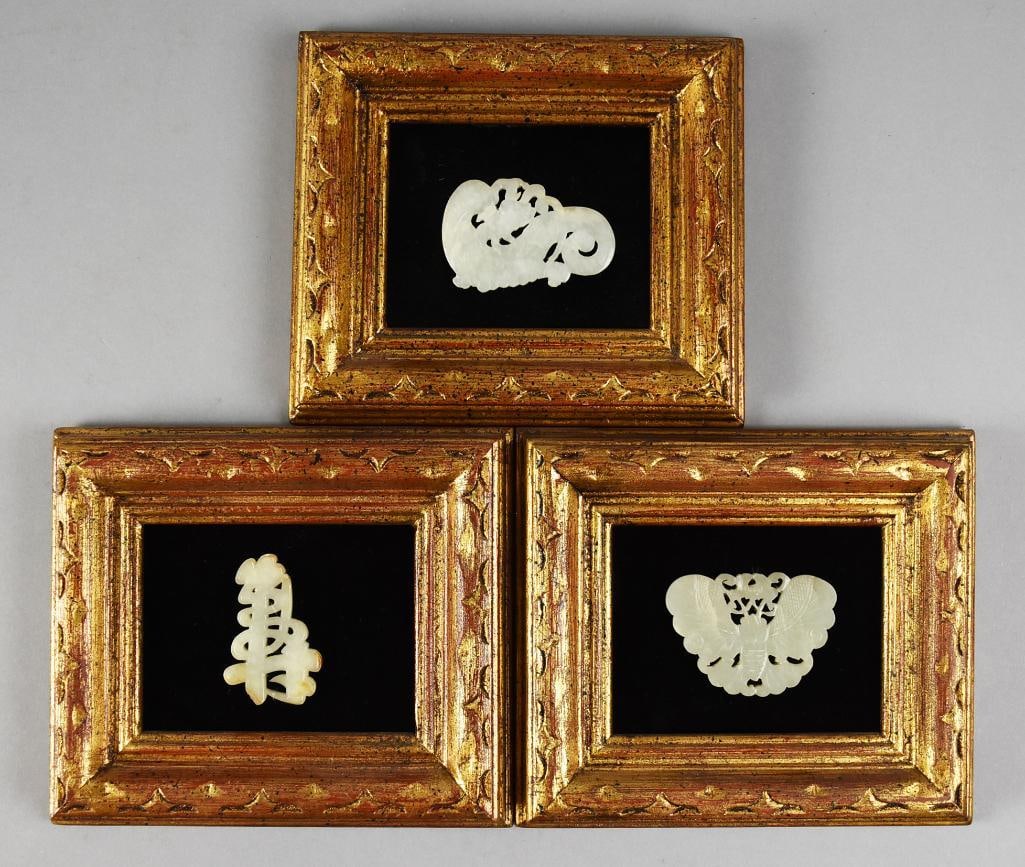 Qing Dynasty Chinese Carved White Jade Pendants, Framed: Gorgeous pendants believed to be from the Qing Dynasty. They appear hand carved in jade with various shapes. There is a butterfly?or moth, a symbol for good fortune and one other with a coiled tail. E