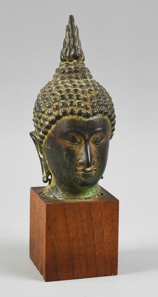 Vintage Thai Sukhothai, Bronze Buddha Bust: Wonderful vintage or antique bust that appears bronze, from Thailand. It is a Buddha or Sukhothai, flame finial on had, eyes looking downward and subtle smile. Mounted to a square solid wood base. Sta