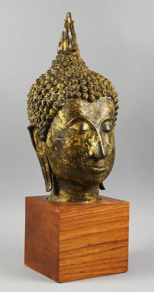 Vintage Thai Sukhothai, Bronze Buddha Bust: Wonderful vintage, could be antique, Thailand Sukhothai, or Buddha bust that appears bronze. Has a flame finial, eyes looking downward, elongated ears and subtle smile. Mounted to a square solid wood 