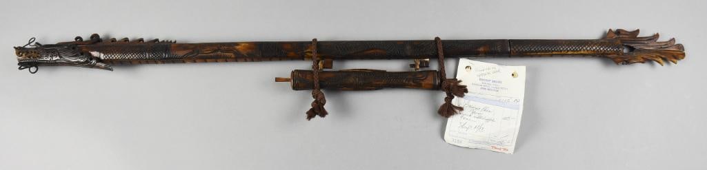 Vintage Borneo Carved Water Buffalo Horn Blow Gun: This very cool piece is a blow gun from Borneo. It appears hand carved from water buffalo bone (or horn). Dragon head appears hand carved with hand carved dragon with scales and flame tail. The dart t