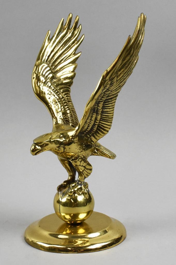 Gorgeous Bald Eagle Brass Figure: Cool piece of vintage Americana. Bald eagle gripping a ball. It appears to be brass plated over base metal. Marked Mexico and stands approx. 12" tall