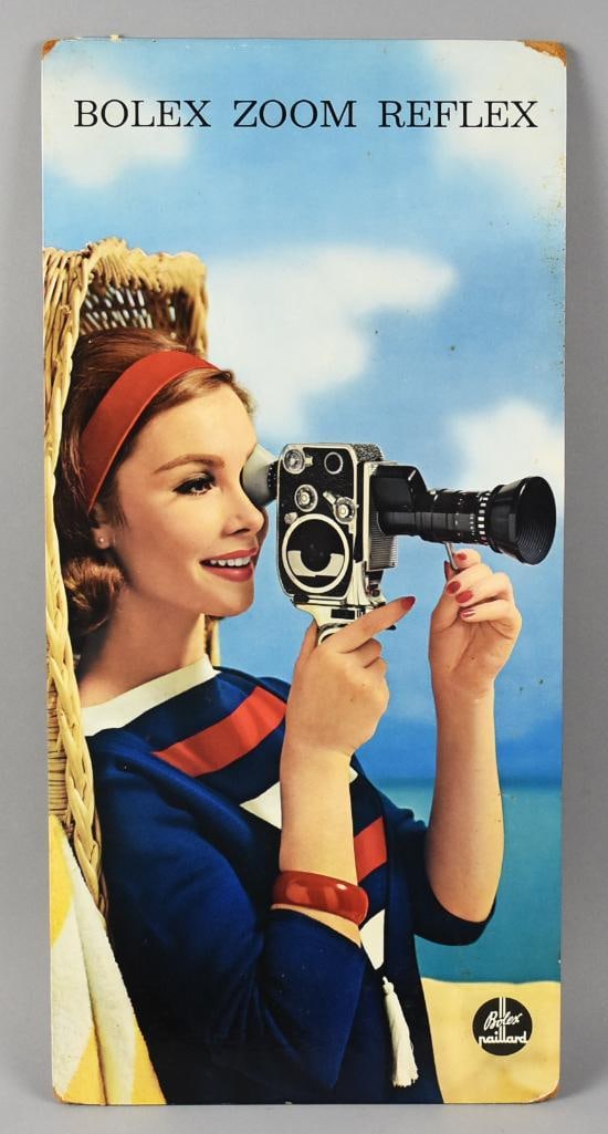 RARE! c1950 Bolex Paillard Zoom Reflex Camera Countertop Ad: This is a wonderful and rare store advertising for a Bolex Paillard Zoom Reflect video camera. Features a smiling beautiful woman using the camera with blue sky and a waterway in the background. It