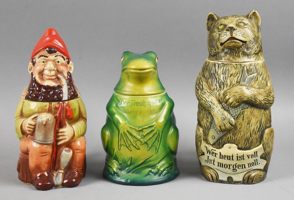 Vintage/Antique German Figural Lidded Beer Steins: Wonderful grouping of vintage beer steins, all made in Germany. One is and Original Gerz, c1905. He is stoneware of a gnome smoking a pipe and holding his own stein. The next is a frog number 825 by