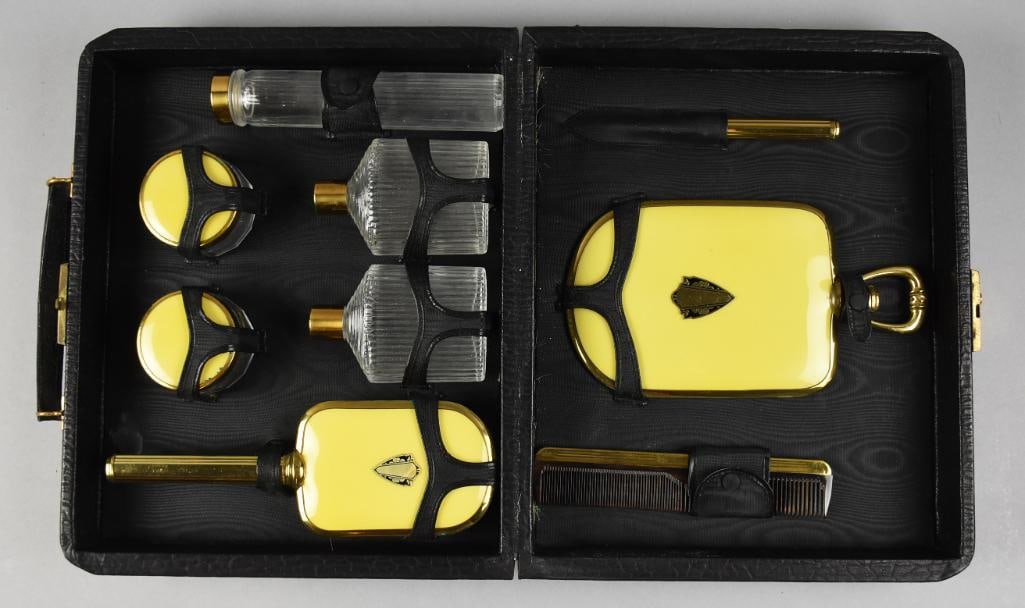 c1930 Art Deco Travel Vanity Set in Case: Beautiful vintage vanity case filled with grooming items. It contains a mirror, brush, comb bottles and other items a lady may need while traveling. It comes in the original case lined with black moir