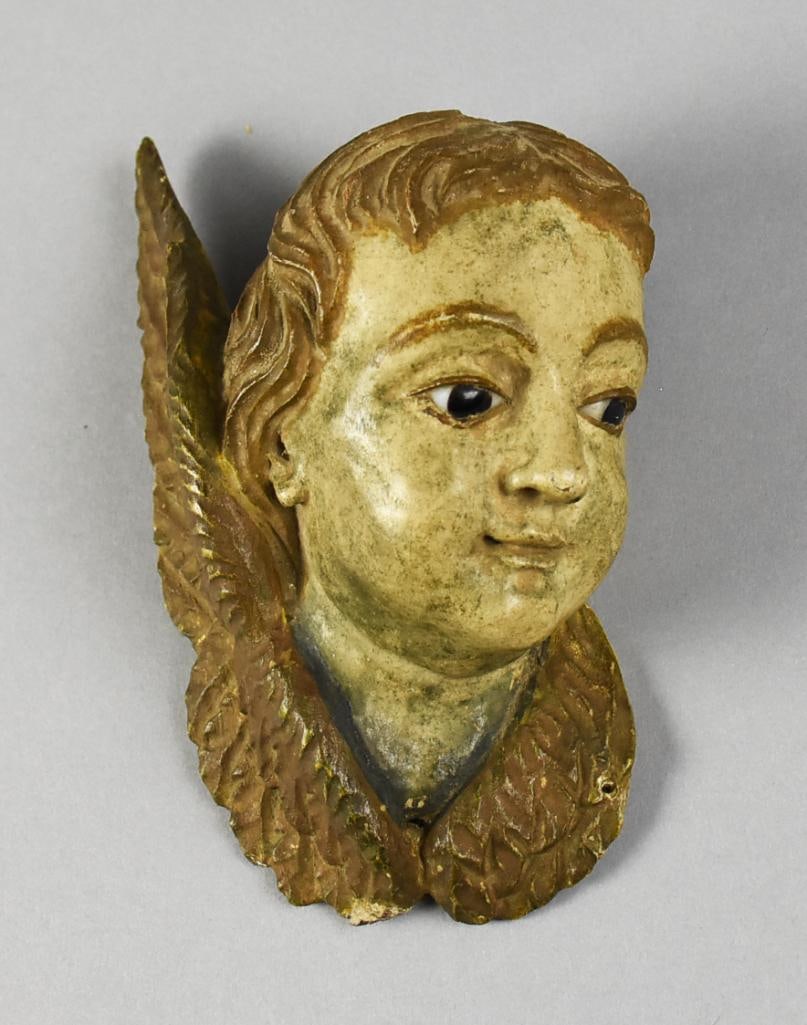 19th Century Spanish Church Polychrome Putto Glass Eyes: Wonderful antique carved wooden cherub appears to be of Spanish origin with glass eveys. This putto appears hand carved with polychrome paint. He has a subtle smile and glancing downward. Measures
