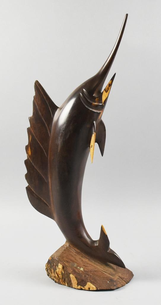 Vintage Hand Carved Ironwood Marlin Sculpture: This wonderful piece is a vintage marlin. It is hand carved and appears to be ironwood with what appears to be inlay of a light hardwood, possibly from Mexico. It is mounted to solid wood base.