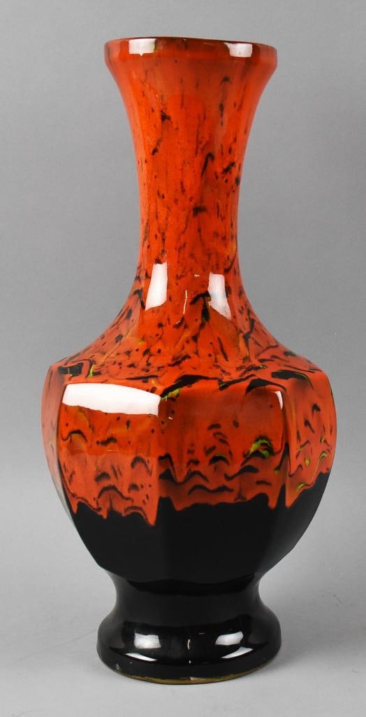 c1960 Mid Century Flambe Glaze Vase: Beautiful vintage vase from the 1960s. Bright flambe?drip glaze, orange over black, hexagon body. Glazed black inside. No visible marks, stands approx. 17" tall.? Great tall MCM mid Century Modern
