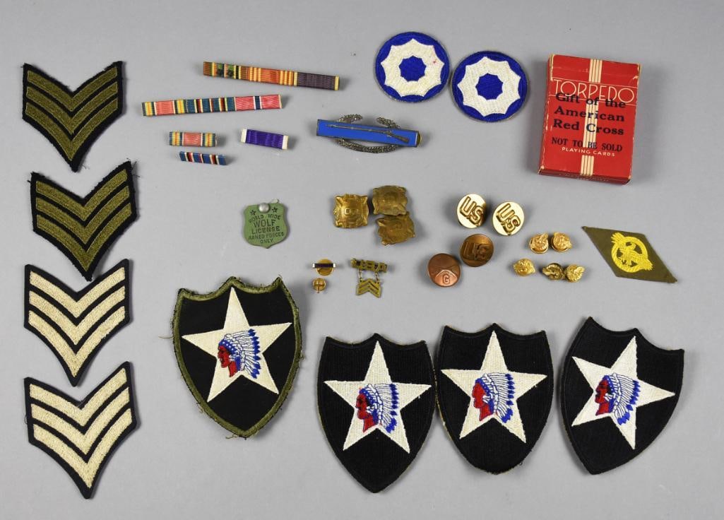 WWII U.S. Army 2nd Infantry Division Patches, Pins, Ribbons & Insignia Group: Large grouping of vintage WWII-era U.S. Army insignia and military ephemera, highlighted by four embroidered 2nd Infantry Division "Indianhead" shoulder sleeve patches featuring the distinctive
