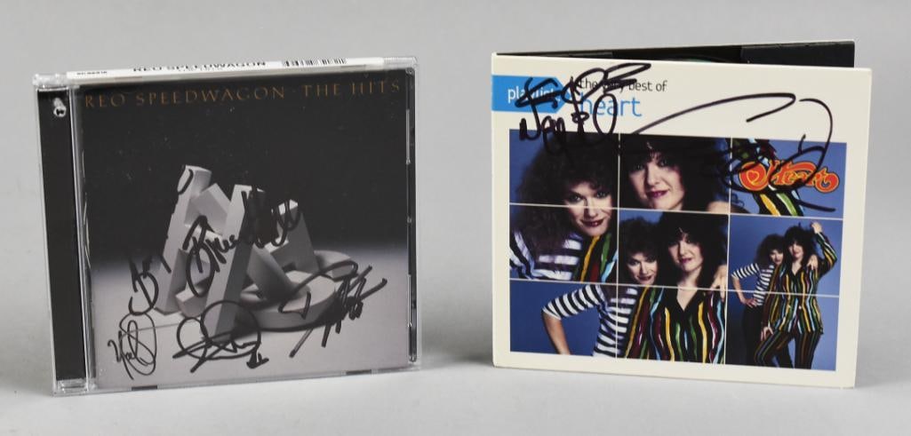 Heart, Ann & Nancy Wilson REO Speedwagon Signed CDs: The Very Best of Heart CD signed by sisters Ann and Nancy Wilson. Seattle band formed in 1976, REO Speedwagon signed by Bruce Hall, Neal Doughty, Dave Amato, Brian Hitt and what appears to be Kevin Cr