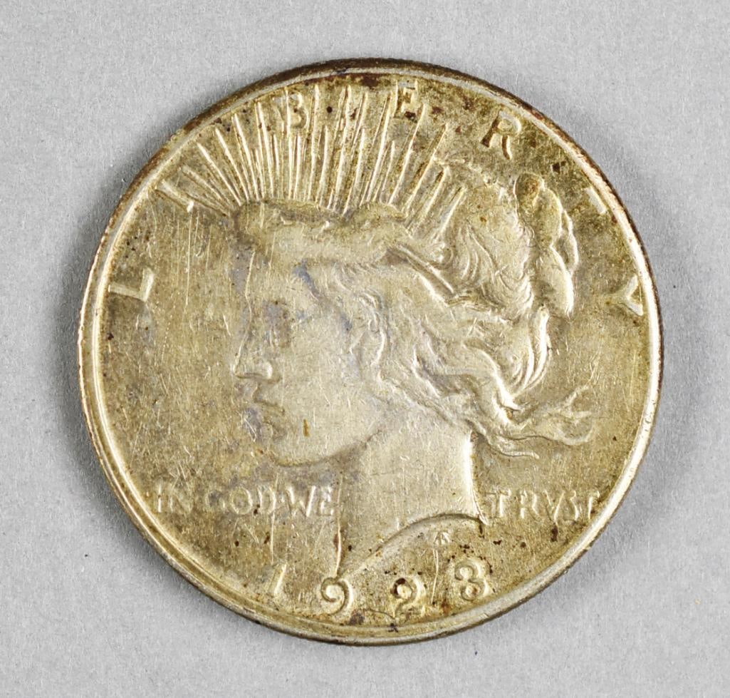 1923 Silver Peace Dollar: Lot is a 1923 silver Peace dollar.