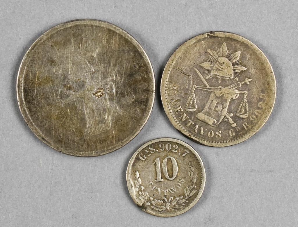 1875, 1890 and 1892 Silver Mexican Coins: Lot is for three great antique Mexican silver coins. The 1875 is heavily worn, the other two have heavy wear and date 1890 and 1892.