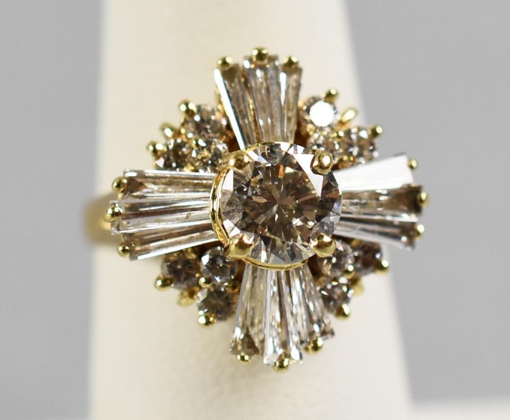 Vintage 14K Yellow Gold & Diamond Cluster Starburst Ring: Stunning cluster diamond ring in 14K yellow gold. Large center round cut diamond that is approx. 1.25 cttw surrounded by baguette and smaller round cut diamonds, all totaling approx. 2 cttw. Stamped
