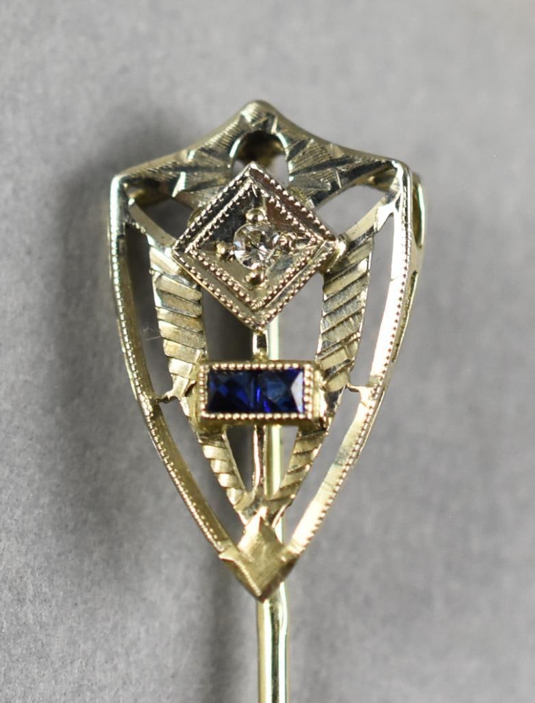Antique Stick Pin Ostby & Barton 18K White Gold & Diamond: This is a fabulous late 19th century stick pin from Ostby & Barton. White gold in the form of a shield. Shield is set with a round cut diamond and emerald cut sapphire. Stamped on pin and measures