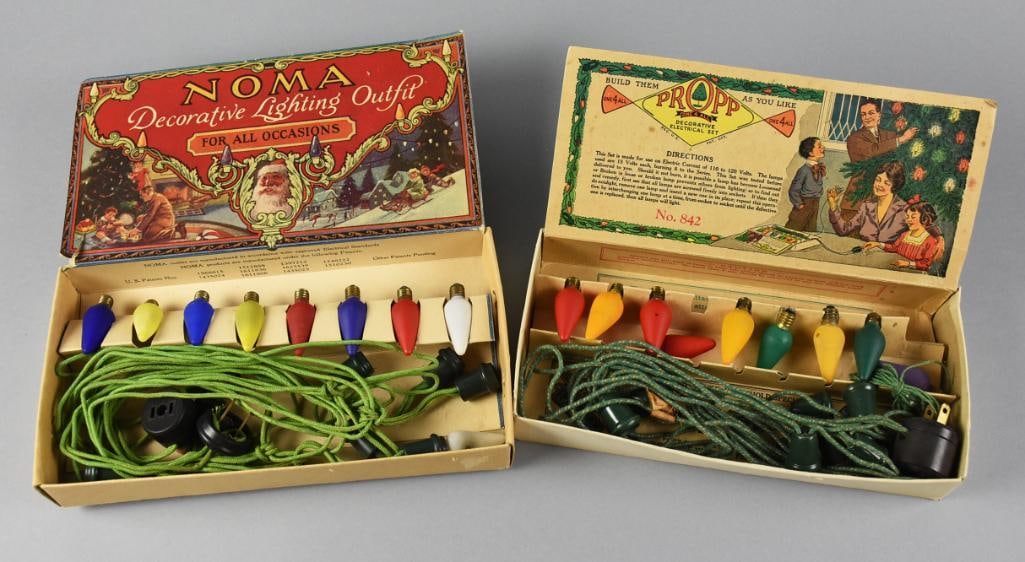 1920s Noma & Propp Christmas Light Outfits, Original Boxes: These beauties include a 1924 Noma Decorative Lighting Outfit. Set with the original light green cloth cord, nine bulbs that appear original. Includes a (Louis) Propp c1925 set with darker green with