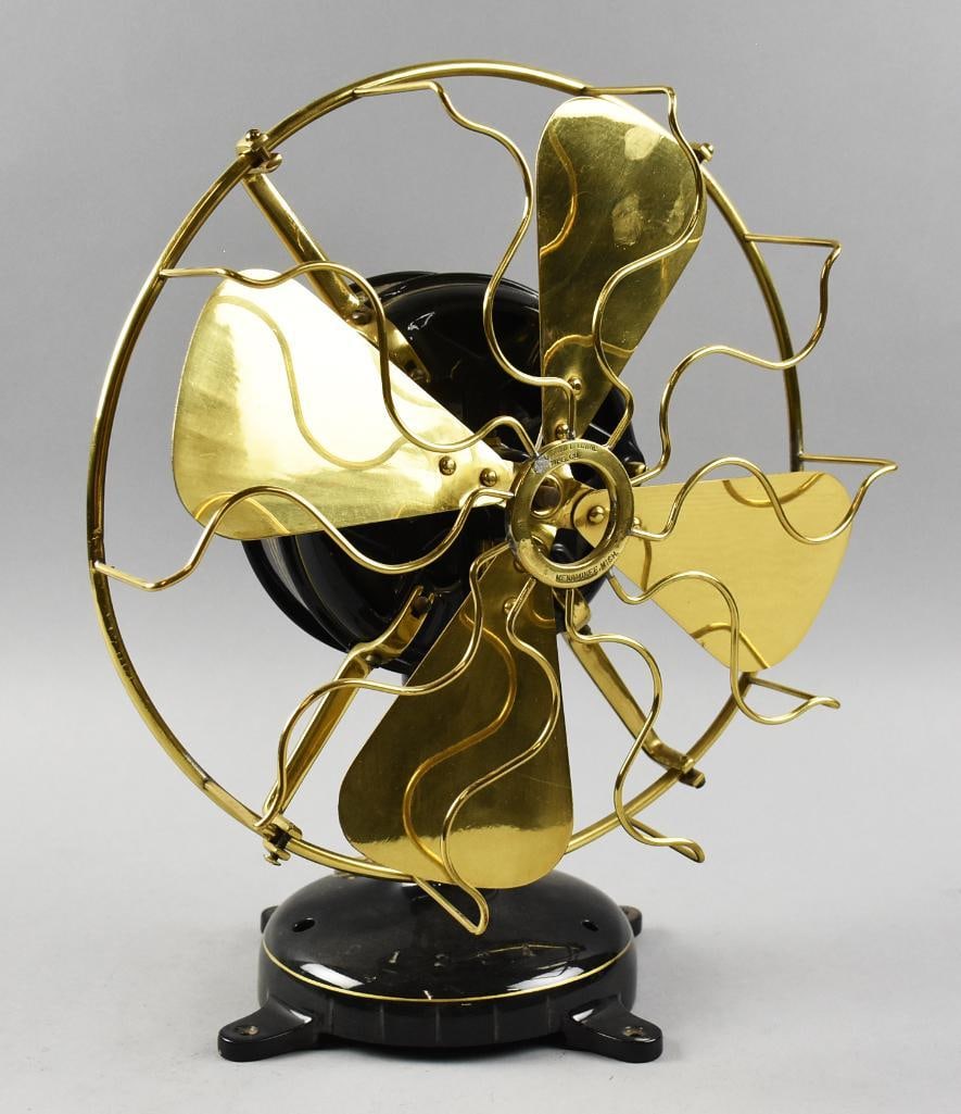 c1915 Menominee Electric Mfg. Co. Table Fan, Restored: This beautiful fan is a Menominee. It has been mostly restored with a rich black enamel and gold paint accent stripes. Brass cage and blades are polished and the mfg. plate is cleaned up and bright.