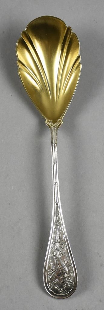 1865 John Wendt Sterling Bird Sugar Spoon, Gold Wash: Wonderful sterling sugar spoon from John Wendt. Pattern is called Bird from 1865. Bowl is gold wash with scalloped rim. Handle is a long tailed bird eating berries in a branch. It is marked on back