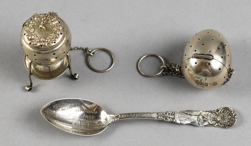 Antique Sterling Tea Strainers & Columbian Exposition Spoon: Cool lot of antique sterling. Includes a souvenir spoon from the 1893 Columbian Exposition with Isabella on the front of the handle and Columbus on back. Stamped SC or CS on back. Tea strainers are a