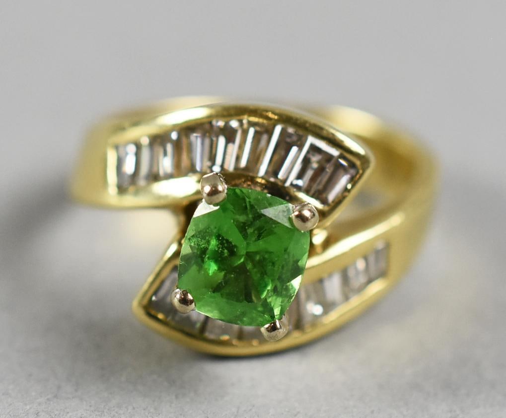 14K Gold Tsavorite Garnet, Diamond Ring: This beautiful vintage ring is in 14k yellow gold. Center stone is a tsavorite garnet, square cut.?It is approx. 1 full ct. It is flanked by 18 baguette cut diamonds, nine on each side. No visible