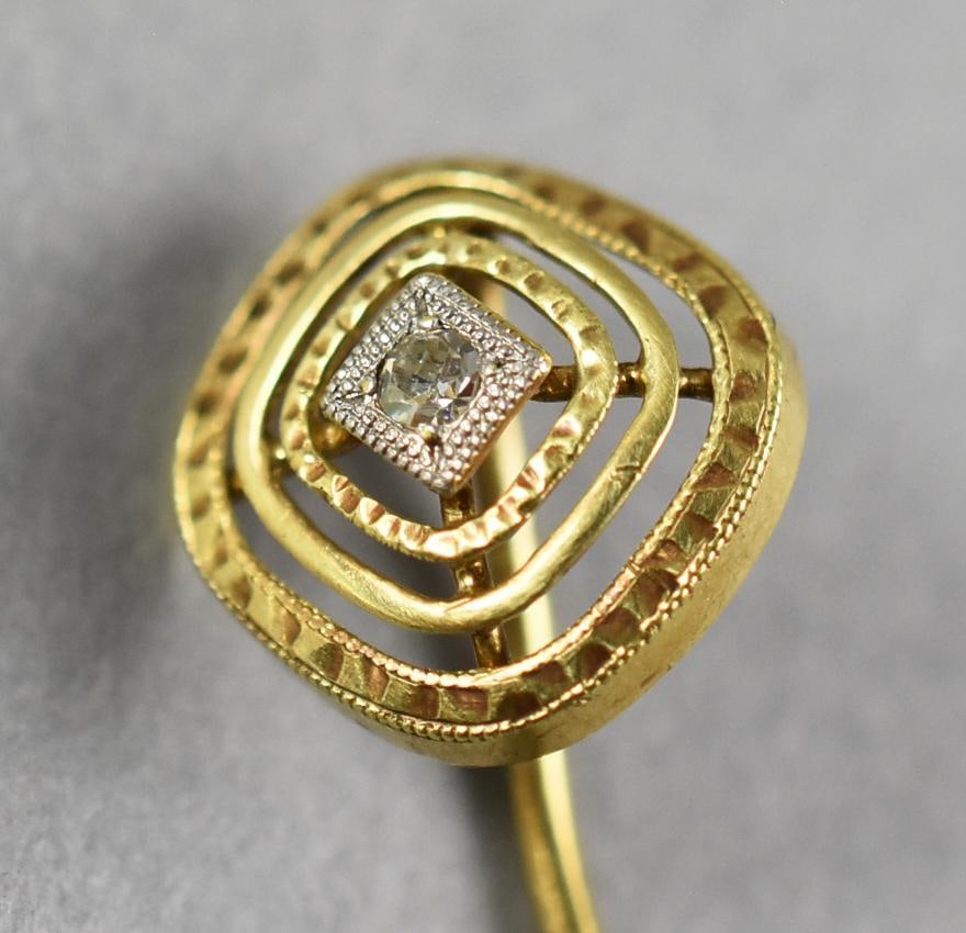 Victorian 14K Yellow Gold and Diamond Stick Pin: Stunning antique stick pin in 14K yellow gold. Multiple circles with hand cut facets set with a 1/32 carat round cut diamond. Stamped on pin with no visible jeweler marks. Measures approx. 2.5" long.