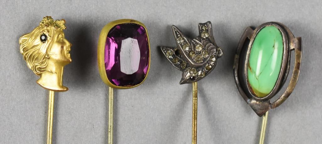 c1920 Gemstone Stick Pins: Beautiful collection of four antique stick pins. Two with semi precious gemstones of amethyst and turquoise. Another is a sparrow with what appear to be paste stones and one with woman's profile and s