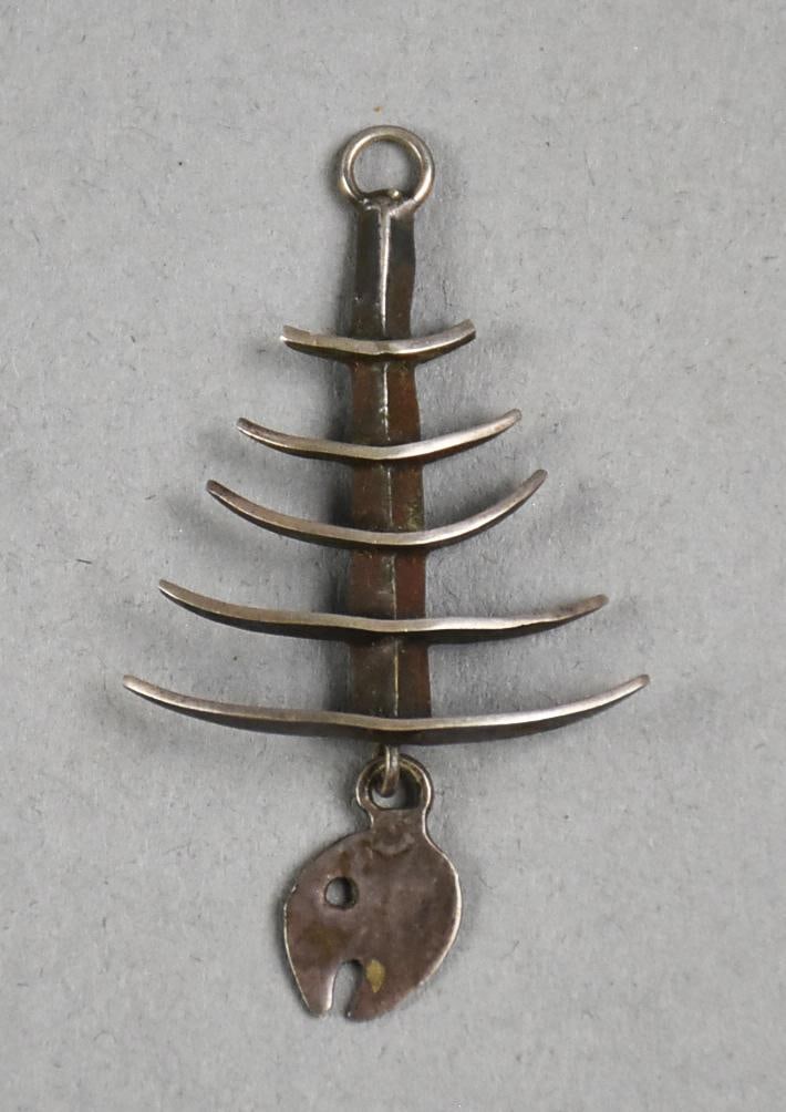 Vintage Taxco Mexico Sterling Fish Skeleton Pendant, Signed: This awesome piece is vintage Taxco sterling. It is a fish skeleton in a modernist style. The head dangles and is marked on back with FC and has an eagle mark, 3 - indicating Taxco. Measures approx. 2