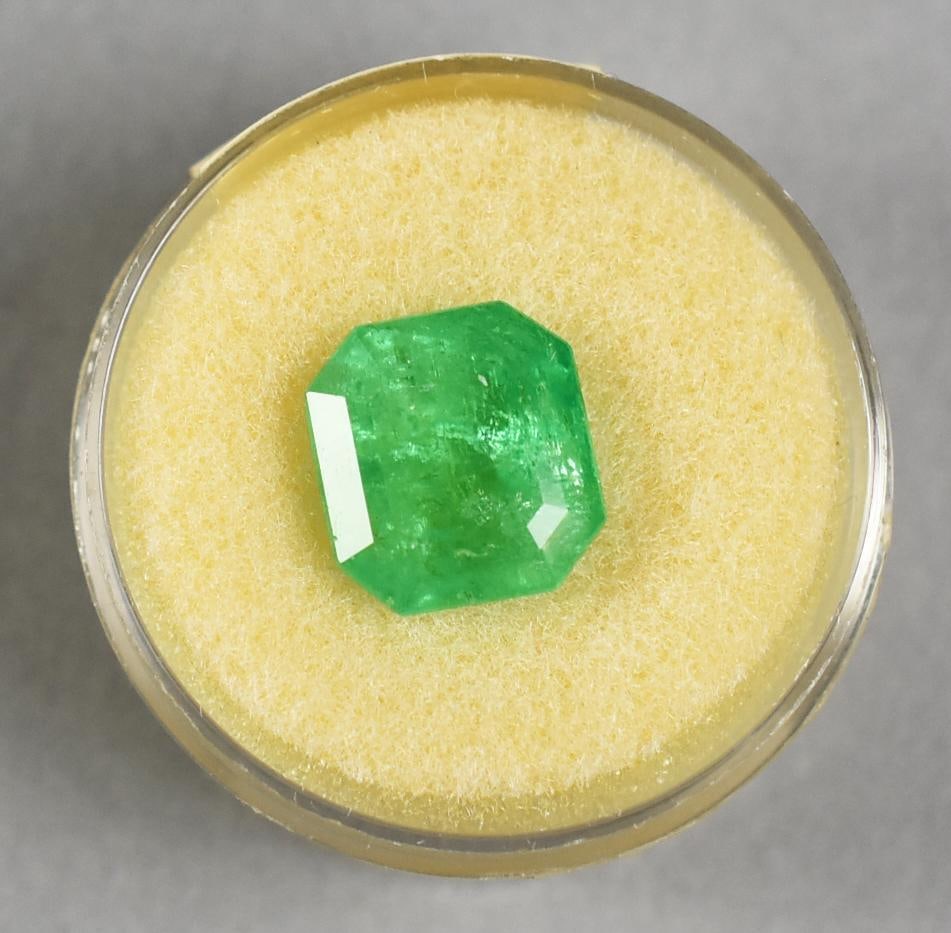 5.45 Carat Columbian Emerald - Loose: This notable Colombian emerald weighing approximately 5.45 carats showcases a vivid green hue and a rectangular step-cut form. Exuding an attractive natural character, this gemstone reflects the