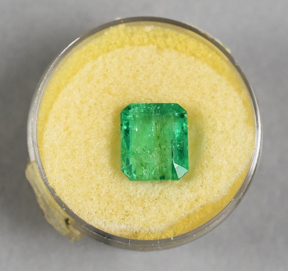 3.9 Carat Columbian Emerald - Loose: Presented is a 3.9 carat loose Colombian emerald, showcasing its natural green hue and classic rectangular cut. Renowned for their superior quality, Colombian emeralds are treasured for their color