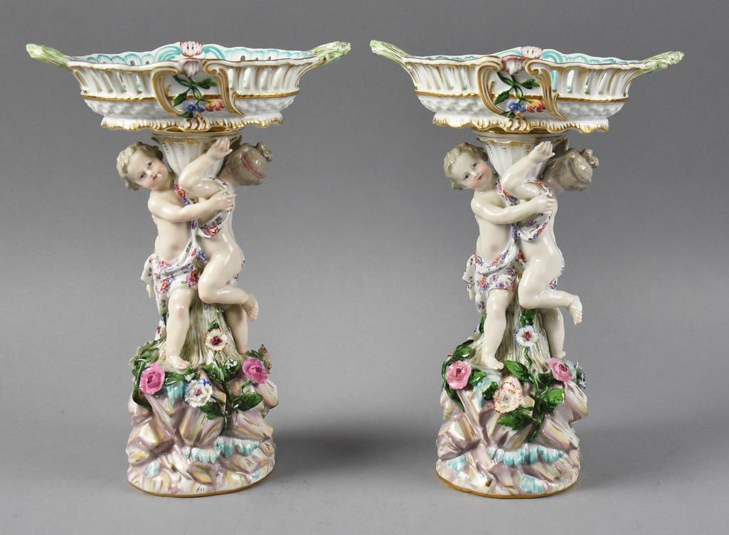 Meissen Porcelain Centerpieces w/ Cherubs 19th Century: This spectacular pair of centerpeices are from Meissen. They are model A.59 originally designed by Johann Joachim Kandler in the mid 1700s. Reticulated bowls hand painted inside blue and white, matchi