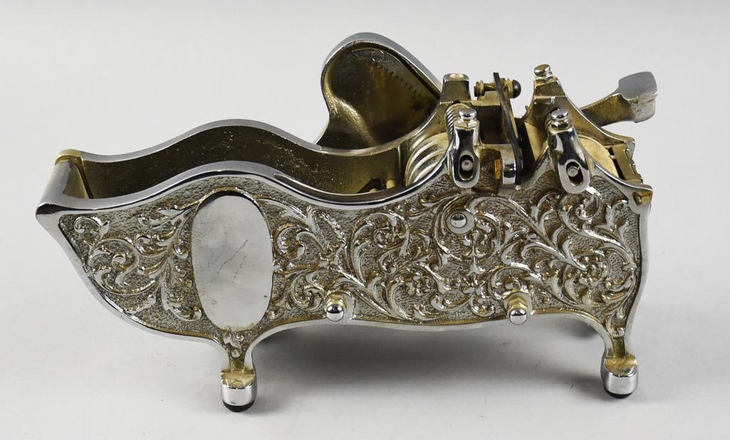 c1900 Nickel Plate Tape Dispenser National Package Sealer Co: Gorgeous packing tape dispenser attributed to National Package Sealer Co. This ornate piece with scroll work detail appears cast iron with a nickel plate. There is a front opening for water, the