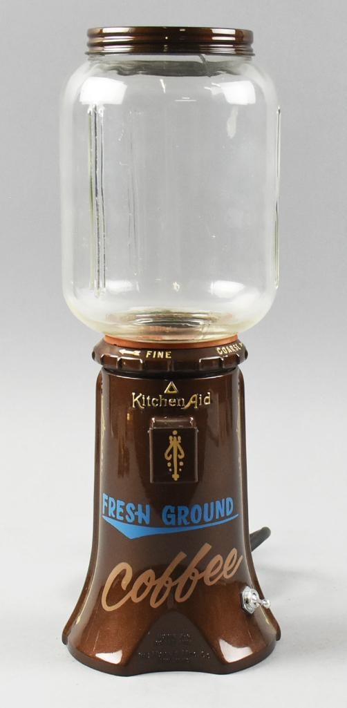 c1935 KitchenAid The Hobart Coffee Mill, A-9: Expertly restored coffee mill from KitchenAid, The Hobart Mfg Co. Vivid metallic brown with blue?Fresh Ground and a tan Coffee in cursive. The embossed lettering is gold and gold pinstripes. It has