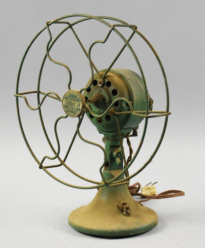 Antique Signal Jr. Desk or Table Top Fan: Fun antique fan from Signal Electric Mfg Co. It is a Signal Jr. Base appears to be cast iron, cage appears steel. Cord looks to have been replaced but is not new. Stands approx. 13" tall. From the