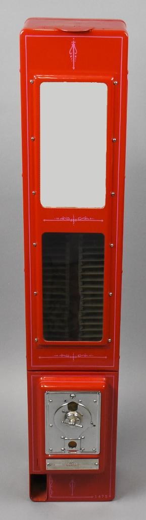 Nickel Candy Vending Machine Automatic Merchandize: This terrific piece is from The Automatic Merchandizer, Inc. It is a 5c candy vending machine that has been fully restored. Bright red enamel base with ornate pinstripes. The side panels are long