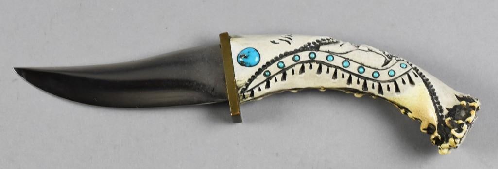 Ted Miller w/ COA Display Knife: This knife is by Ted Miller with a Native American motif, grip with turquoise inlay and sheath with dyed quill and glass beads. Measures approx. 9" and includes a COA.?From the estate of a collector