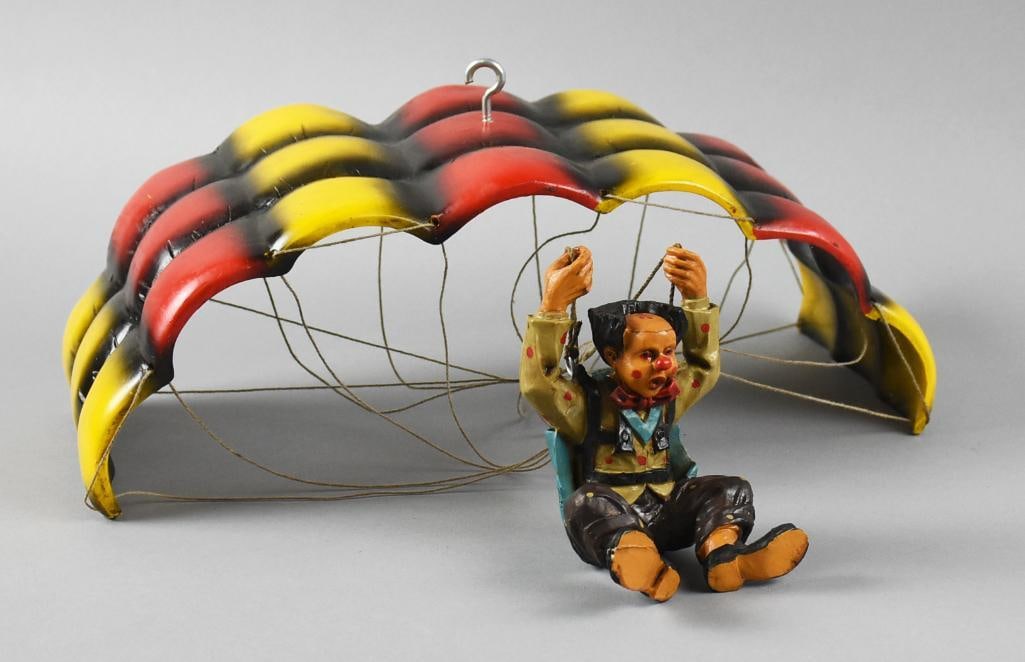 c1970 Allan Agohob Parachuting Clown Figure: Cute vintage parachuting clown from artist Allan Agohob. He appears hand painted, holding the ropes with legs up appearing to be coming in for a landing. His overall approx. measures are 18" x 14" wit
