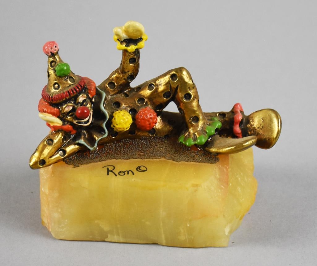 Ronald A. Lee Clown 24k GP & Enamel Clown Figurine, Signed: Very cute vintage clown by artist Ronald A. Lee. It is a 24K gold plated and hand painted lounging clown. Signed by the artist and retains original hang tag. Measures approx. 4" x 4.5".