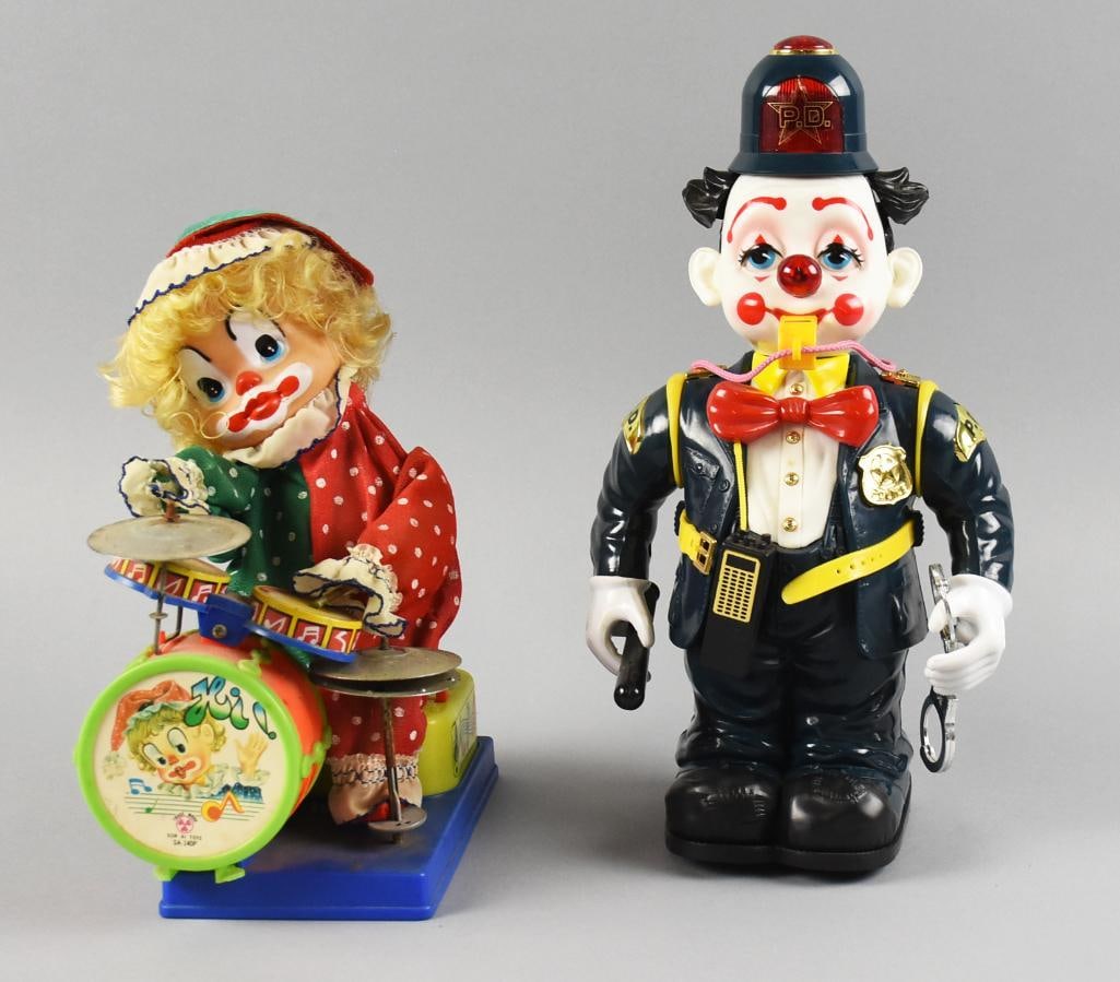 Son AI Toys and New Bright Battery Operated Clowns: Cute pair of vintage clown toys. The Son AI Toys is a drummer and is approx. 11" tall, the New Bright blows a whistle and is approx. 14" tall.