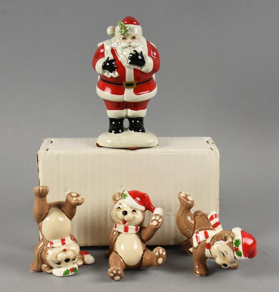 1980s Fitz & Floyd Tumbling Santa Bears, Santa Figurines: Very cute assortment of Fitz and Floyd ceramic figurines. They include a Santa with his toy bag over his shoulder from 1981, approx. 6" tall. Along with a 1986 set of Tumbling Santa Bears in the origi