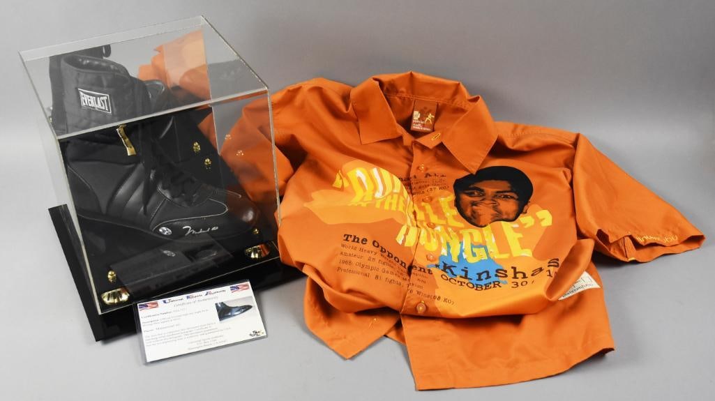 Muhammad Ali Signed Everlast Shoe, Fubu Rumble Shirt w/ COA: The greatest lot for Muhammad Ali fans is this cool Everlast?right shoe signed in silver and includes the COA from Universal Sports Authority, number USA-5713. You'll also get this Ali Platinum Fubu c