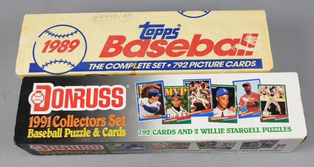 1989 Topps & 1991 Donruss Picture Cards Boxes: This lot features the 1989 Topps Baseball Complete Set, containing 792 picture cards, and the 1991 Donruss Collectors Set, which includes 792 cards and two Willie Stargell puzzles. These sets showcase