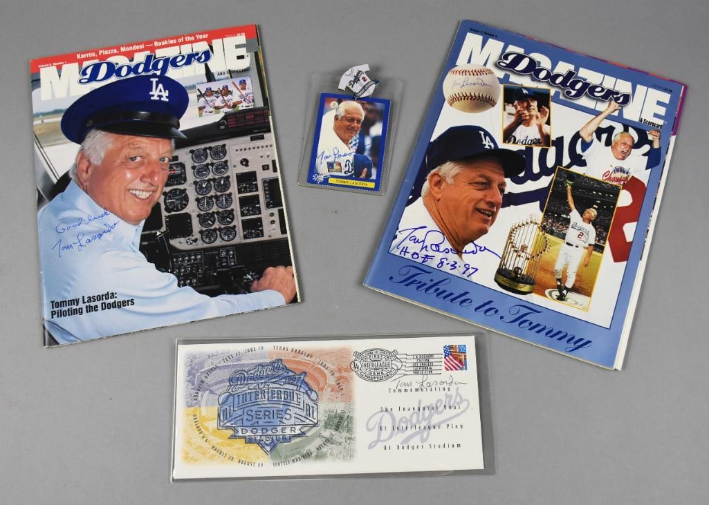 Signed Tommy Lasorda Dodgers Memorabilia Collection: This lot includes an exceptional collection of items signed by Tommy Lasorda, key figure in Dodgers history. Featured are two Dodgers magazines, a Tommy Lasorda baseball card, and a First Day Issue