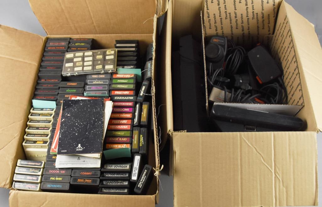 1977 & 1986 Atari Gaming Systems & Lots of Games: Boy how times have changed. It wasn't all that long ago that this game system and all the included games were considered high tech. But here we are. Lot starts with the Atari 2600 from 1977. Embossed 