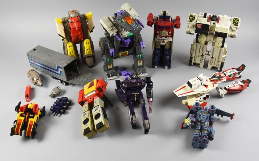 Transformers Action Figures, Hasbro and Takara, 1980s: This collection features a variety of 1980s Transformers action figures, manufactured by Takara Co., Ltd. and Hasbro Inc. The lot includes both Autobots and Decepticons in different forms, with some h