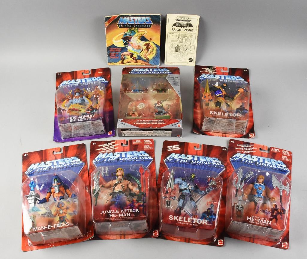 (9) 1980s, 2000s Mattel Masters of the Universe Figs NOS: Lot includes He-Man, Jungle He-Man, Fire Armor Skeletor, two Skeletor (variants) and others. Also included is a vintage read along book and Fright Zone.