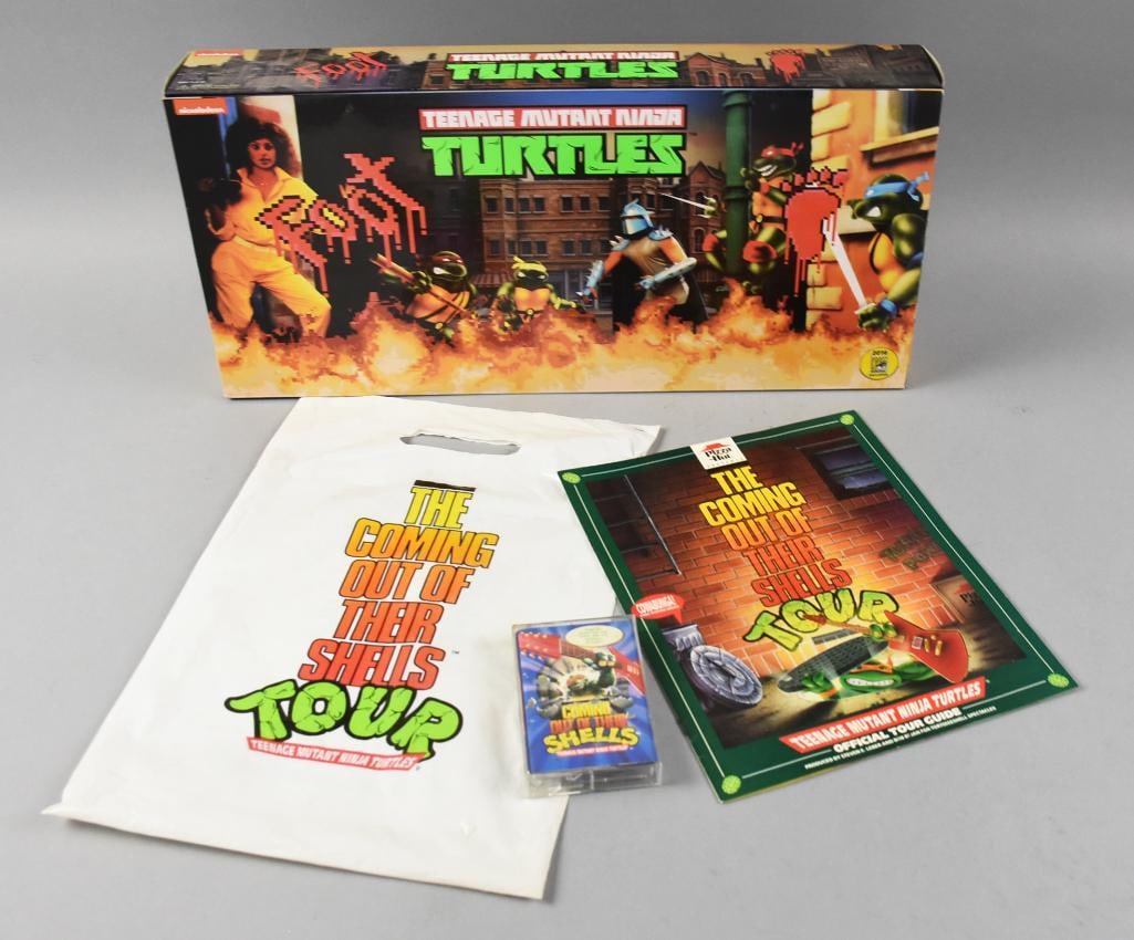 2016 San Diego Comic Con TMNT Box Set, 1990 Cassette: This lot is for a Teenage Mutant Ninja Turtles Pizza Hut promo Coming Out of their Shells cassette tape with a brochure of the tour. Included is a San Diego Comic Con toy set from 2016 from NECA.?
