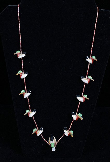 Native American Duck Fetish Necklace Possible Mitchell: 11 duck fetish & bead necklace made of Cowry Shells & semi precious stone attributed to Matt Mitchell 26 inches length 18% buyers premium.