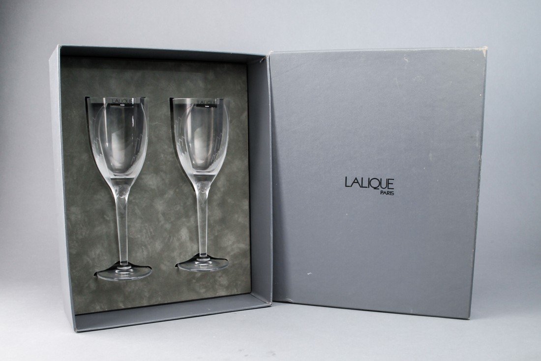 Lalique "Angel Wing" Wine Stem in Box: Lalique wine stem glasses in the Angel Wing pattern with original box. Each glass is etched Lalique France and stands 8 1/4" tall very good.