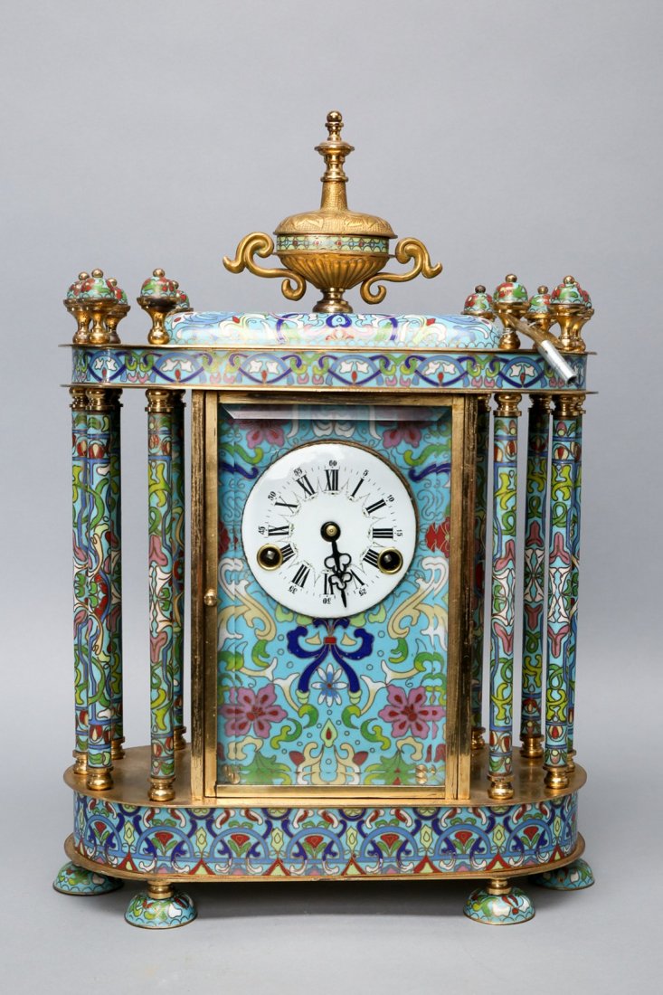 Vintage Chinese Cloisonne Table Clock with Key: Beautiful wind up cloisonne table clock (with key), unknown clock maker. Larger clock with brass/cloisonne finials surrounding an urn shaped center finial. Pendulum is seen from the back, nice hand pa
